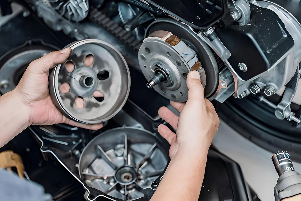 A Person is Working on a Motorcycle Pulley and Engine — Mid Coast Bearing Centre in Gloucester, NSW
