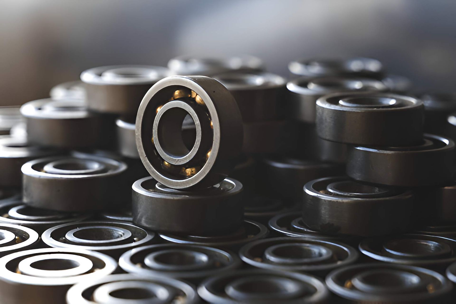 A Bunch of Bearings Are Stacked on Top of Each Other on a Table — Mid Coast Bearing Centre in Taree, NSW