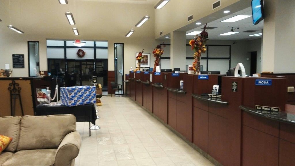 A bank with a couch in the middle of the room