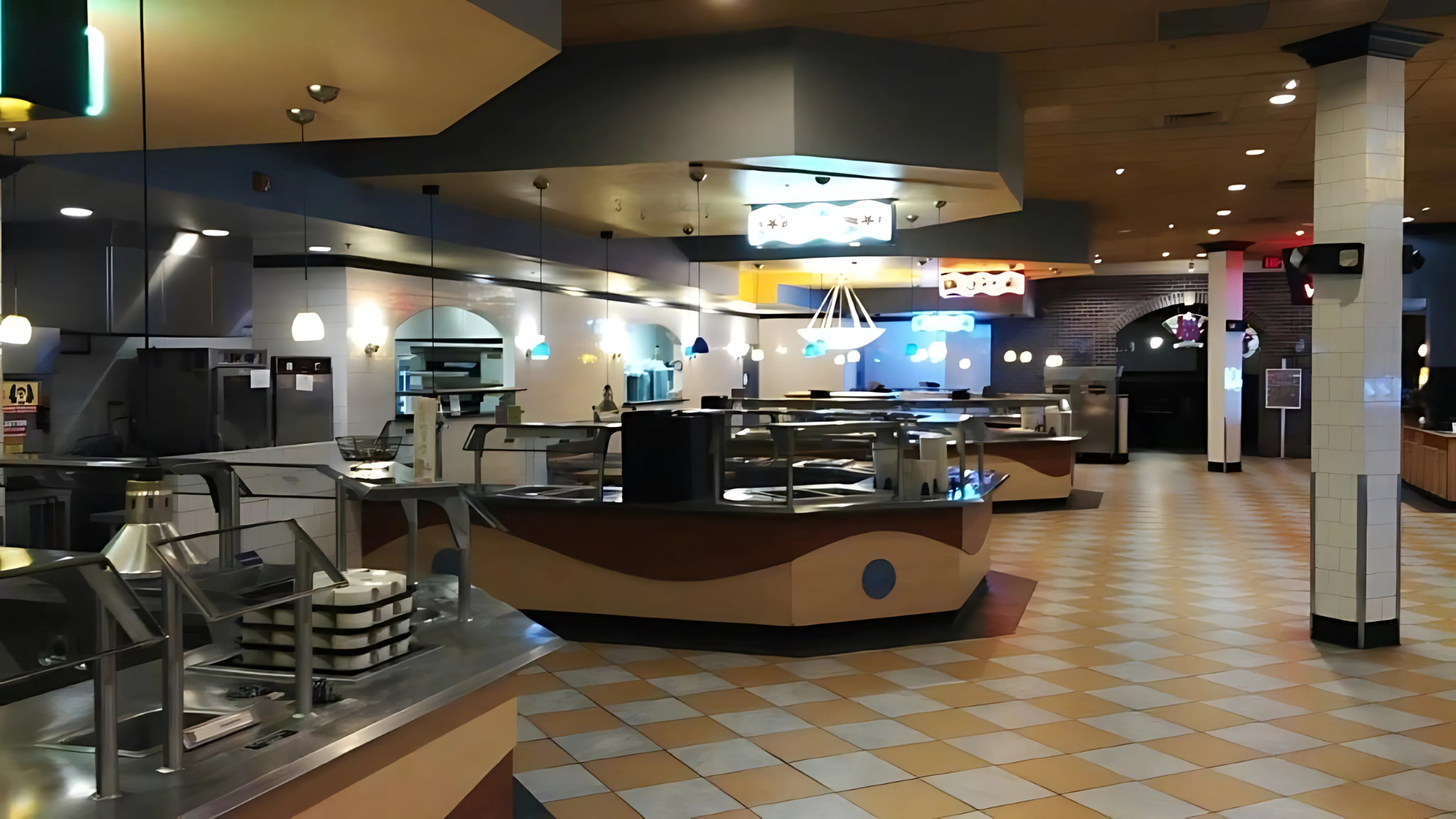 A restaurant with a lot of counters and a sign that says ' buffet ' on it.