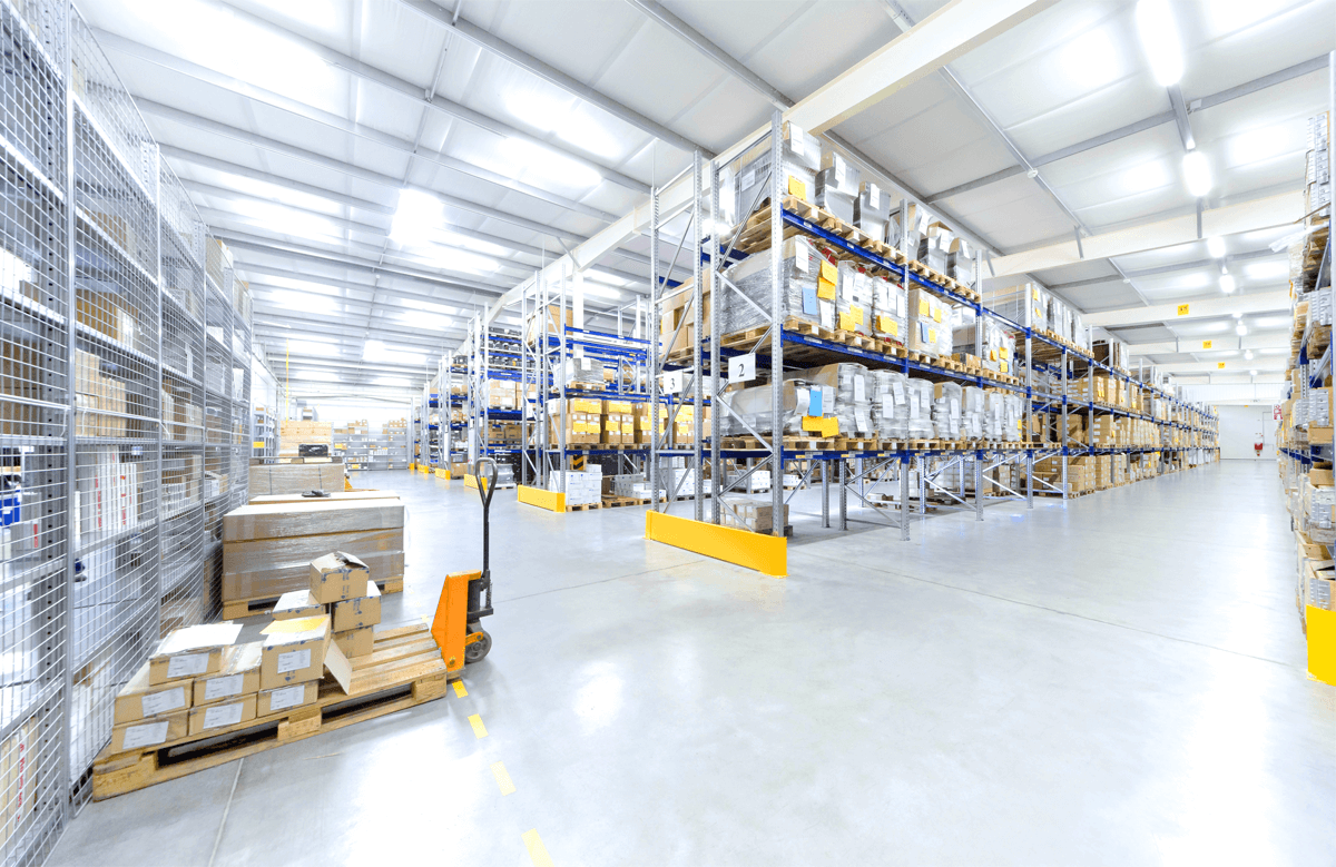 A large warehouse filled with lots of shelves and boxes.