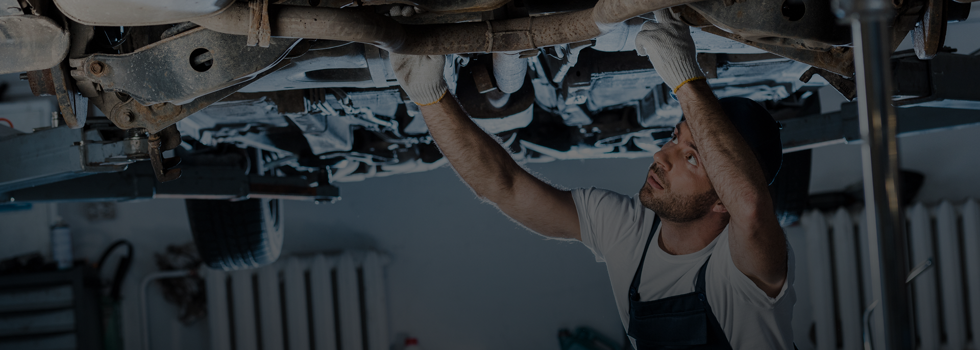 mechanic working under car | Noller Fleet & Auto Service