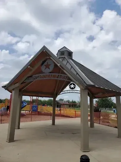 Burleson Electrician - Covered pavilion with a star emblem at Pana'ewa Park, surrounded by a partly cloudy sky.