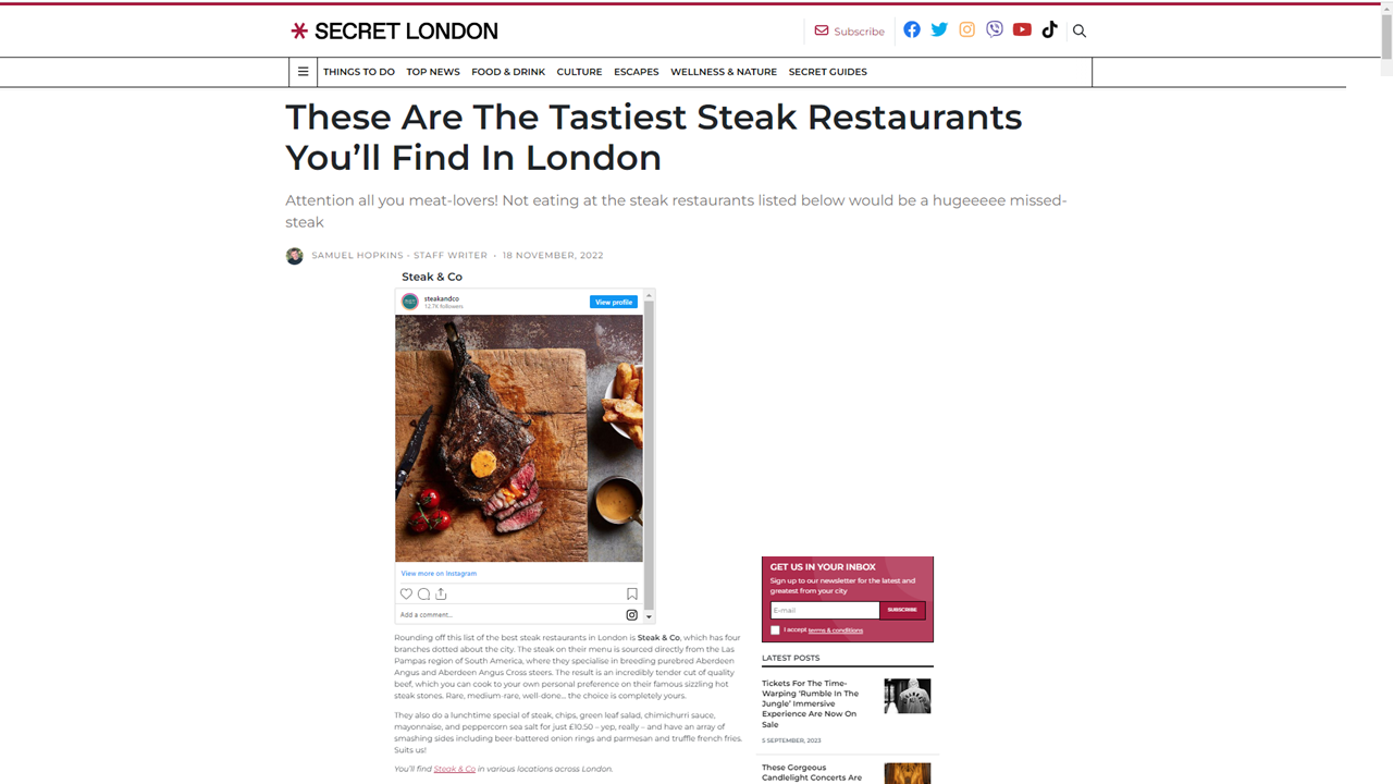 Article about steak restaurants in London with a photo of a cooked steak on a wooden board.