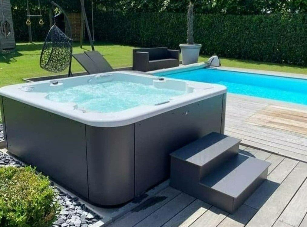 a hypa spa hot tub by the pool