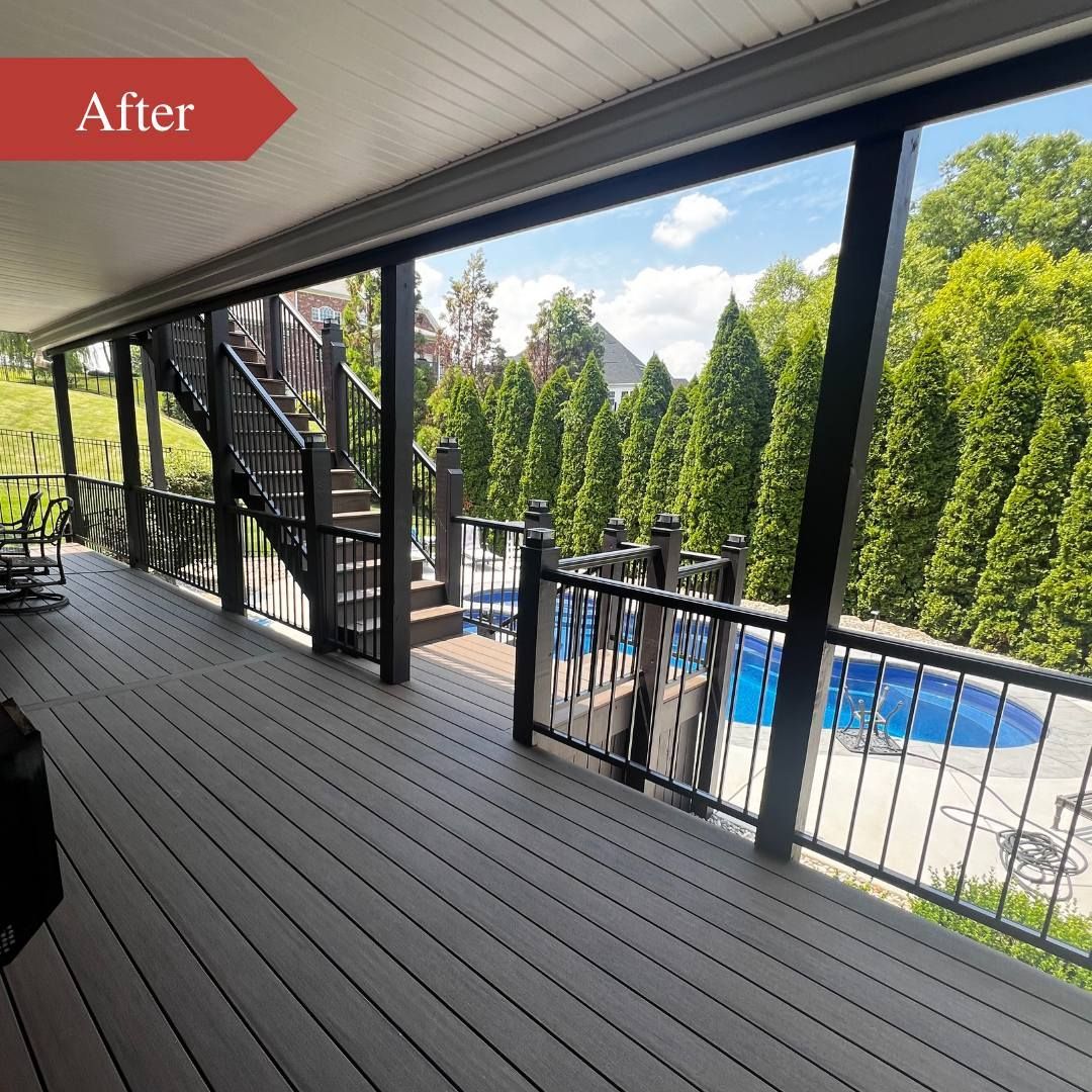 A deck with stairs leading up to it and a pool in the background.
