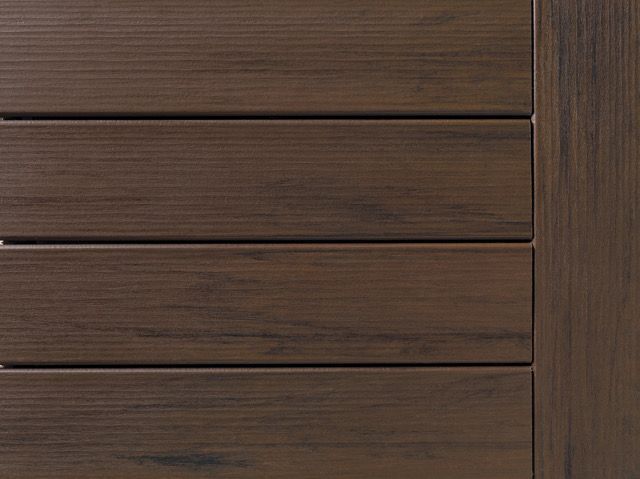 Close-up of a brown wood plank surface with horizontal lines and a vertical frame.