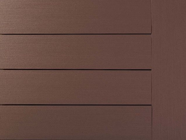 Close-up of brown wooden siding with horizontal planks and a vertical border.