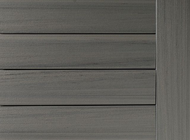 Gray composite wood planks and vertical side panel.