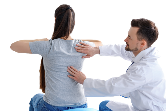 A doctor is examining a woman 's back on a white background.