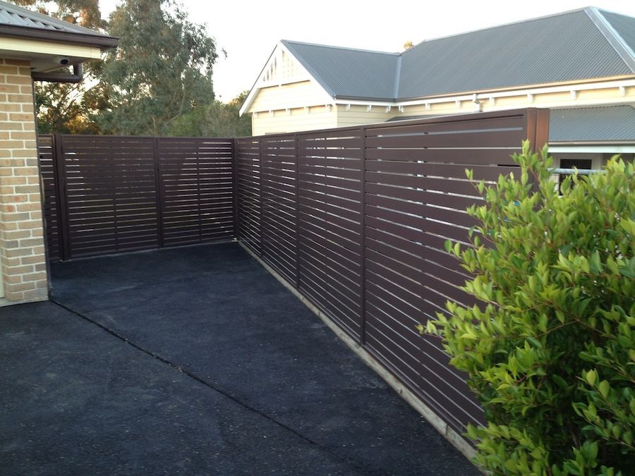 A Brown Privacy Screen on the Side of a House — Newcastle & MidCoast Privacy Screens & Gates In Kurri Kurri, NSW