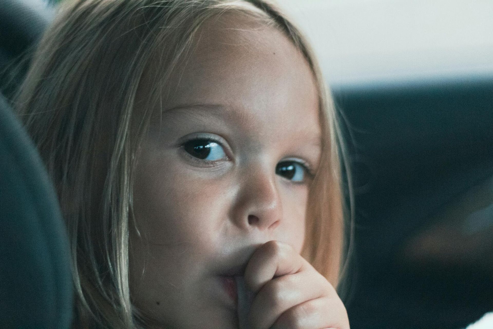 A small girl thinking