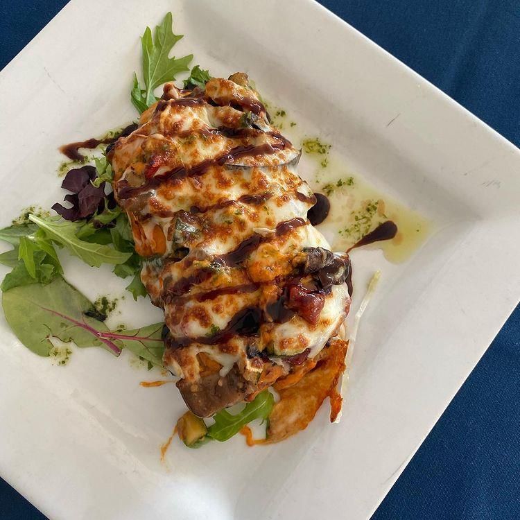 A white plate with a piece of food on it