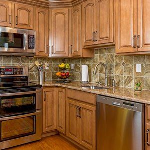 Kitchen with mocha wood cabinetry - Pest Control in Spring Hill, FL