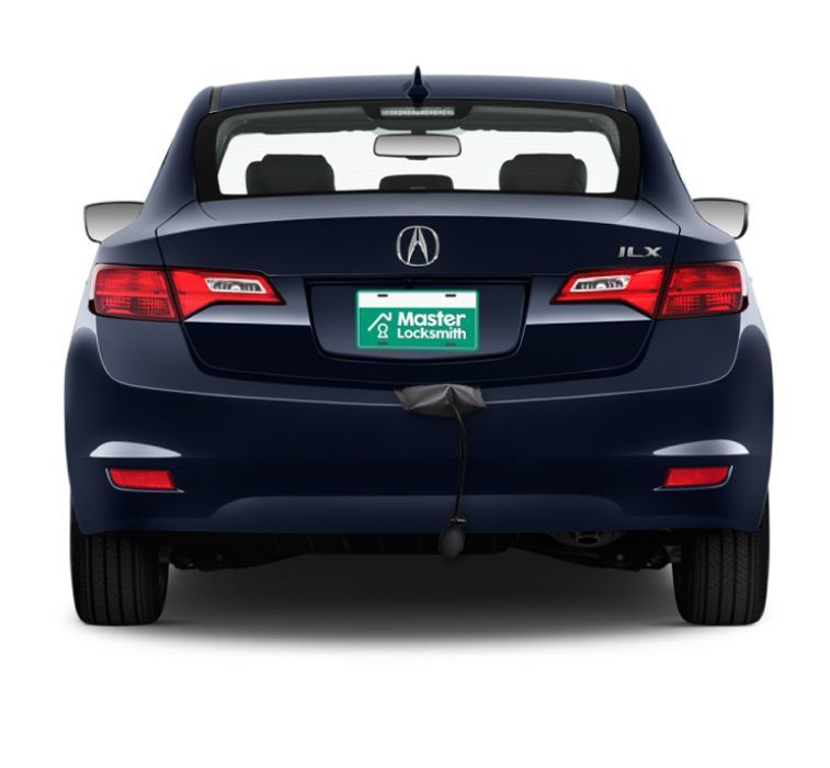 Back View Of An Acura Showcasing A 'Master Locksmith' Branded License Plate.