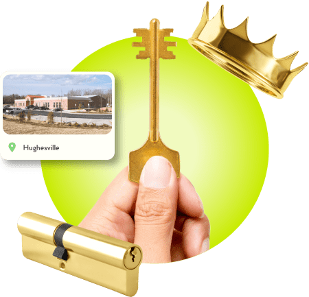 A Locksmith Technician's Hand Holding A Gold Master Key Near A Gold Crown, A Golden Cylinder Lock, And An Image Of Hughesville City In Charles County.