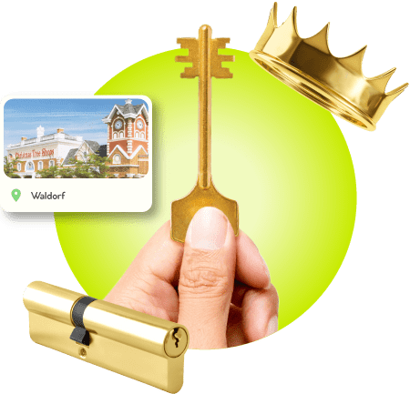 A Locksmith Technician's Hand Holding A Gold Master Key Near A Gold Crown, A Golden Cylinder Lock, And An Image Of Waldorf City In Charles County.
