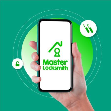 A Person Is Holding A Cell Phone With The Master Locksmith Logo On It
