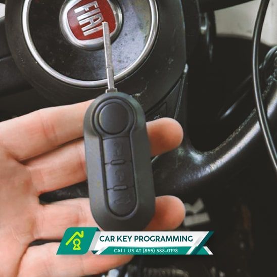 An Automotive Locksmith Holds A Flip Key In One Hand. 