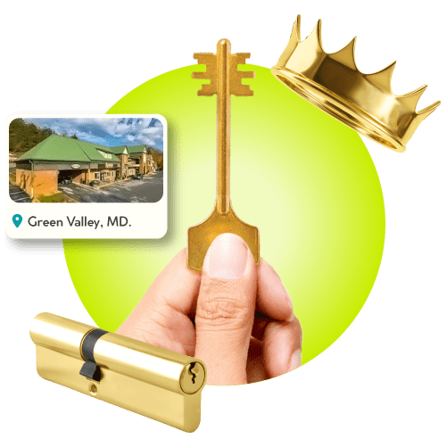 Locksmith Hand With Master Key Near Gold Crown, Brass Lock Cylinder, And Framed Map Of Green Valley City In Frederick County.