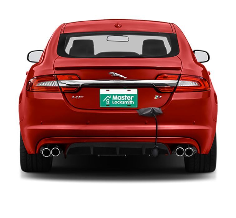 Back View Of A Jaguar Showcasing A 'Master Locksmith' Branded License Plate.