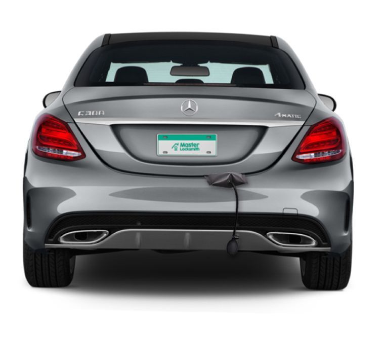 Back View Of A Mercedes Showcasing A 'Master Locksmith' Branded License Plate.