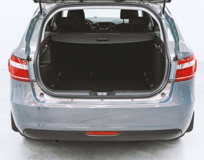 The Trunk Of A Car Is Open And Empty.