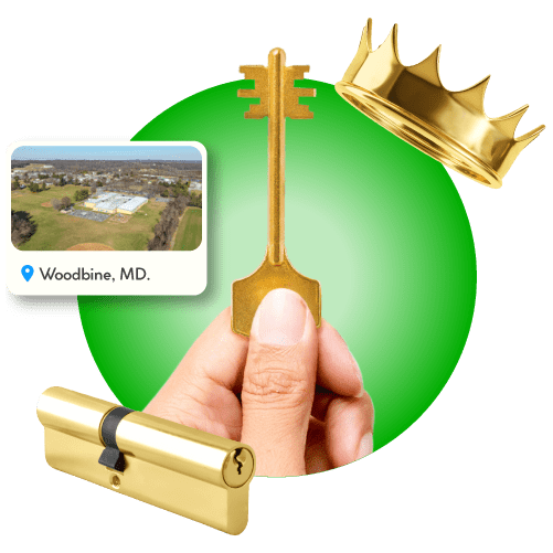 Locksmith Hand Holding Master Key Beside Gold Crown, Brass Lock Cylinder, And Framed Woodbine View In Carroll County.
