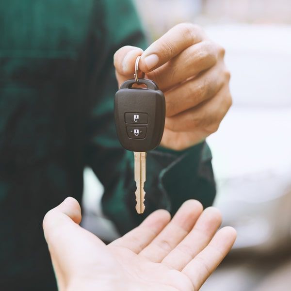 Car Locksmith Delivers New Car Key Head Remote To Customer.