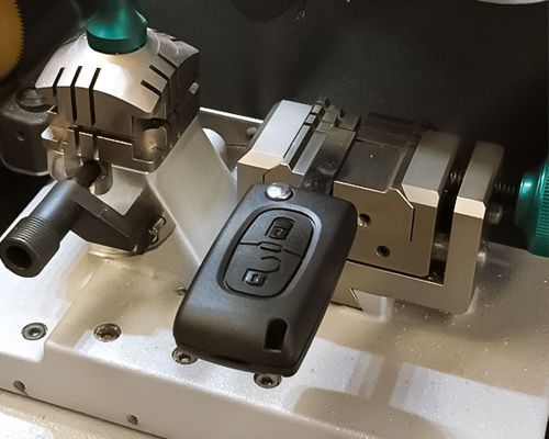 A Flip Key Is On A Laser-Cutting Machine.