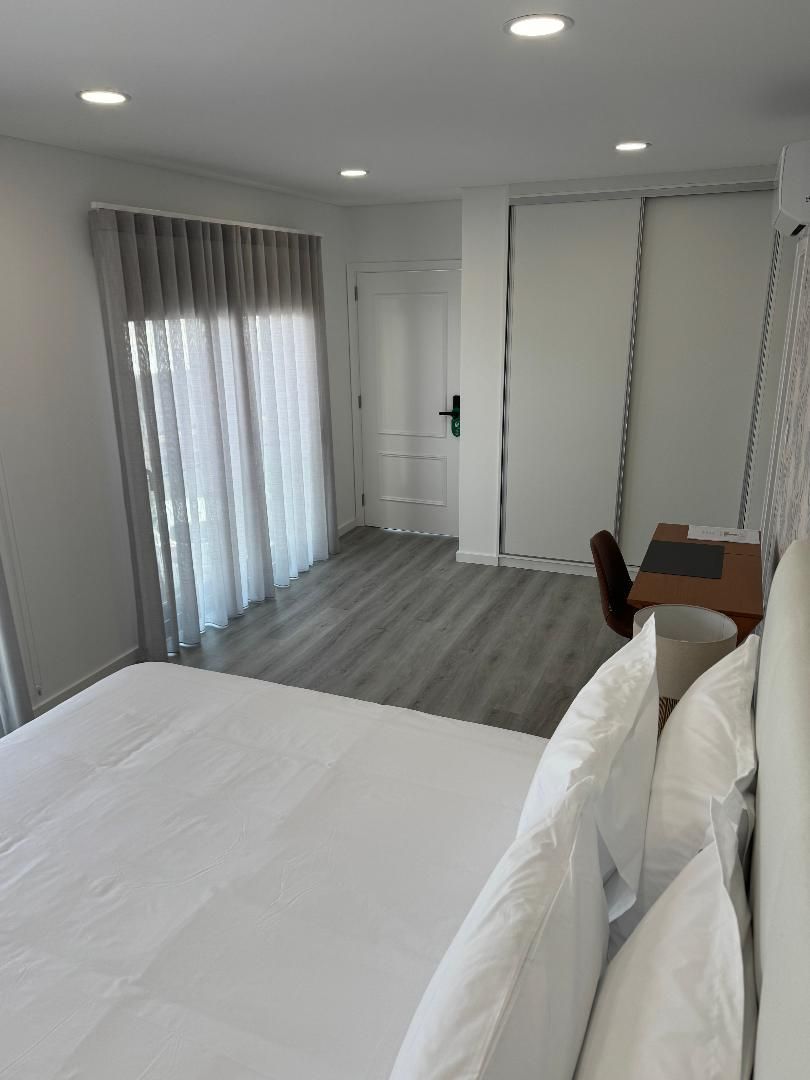 Queen bed with wardrobe closet and desk