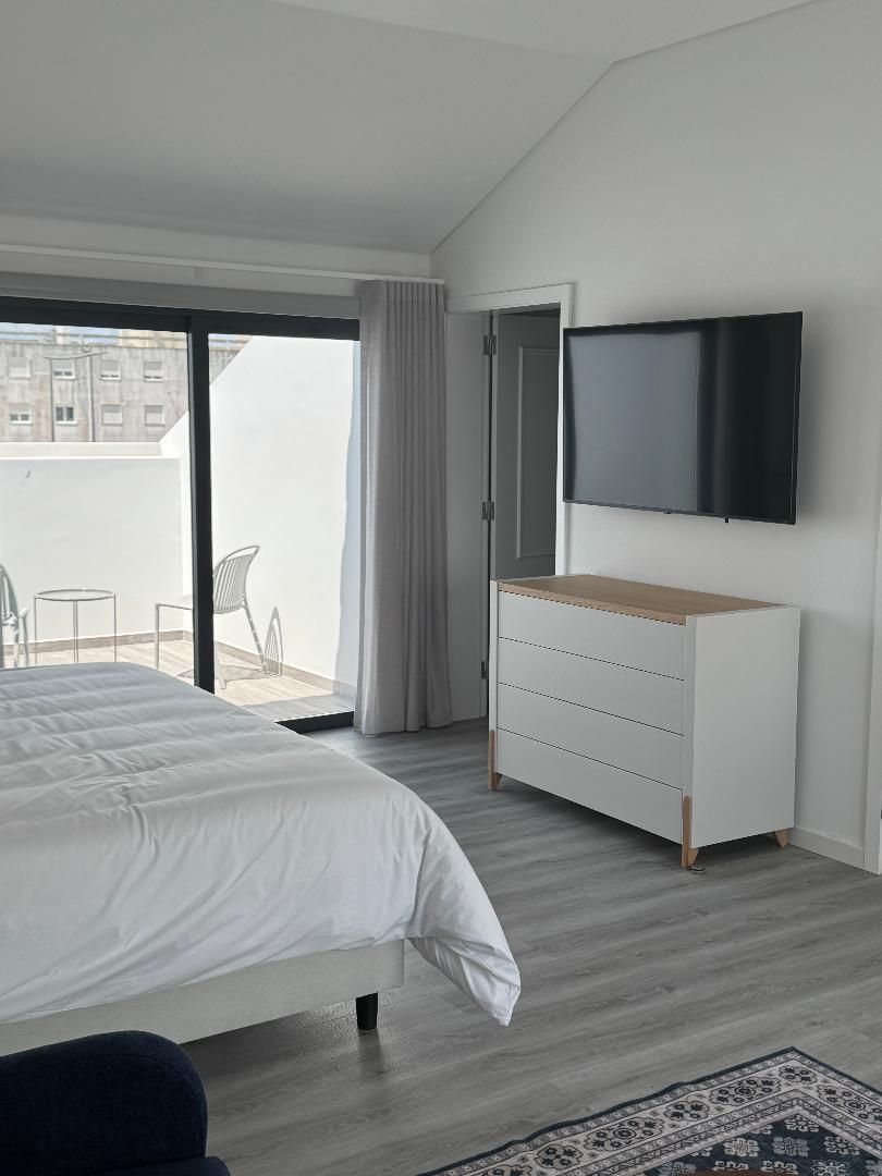 King bed, furnished balcony, dress and flat screen TV
