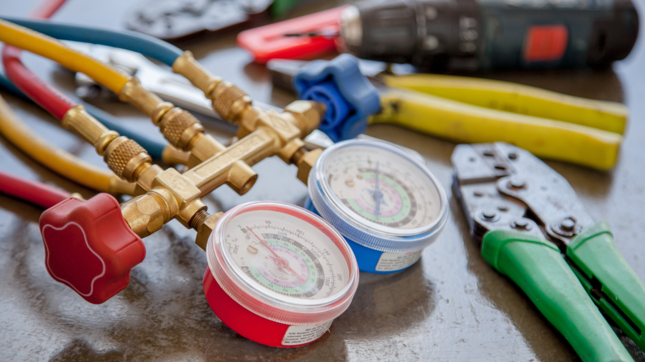 a woman is sitting on a bed using a laptop computer .