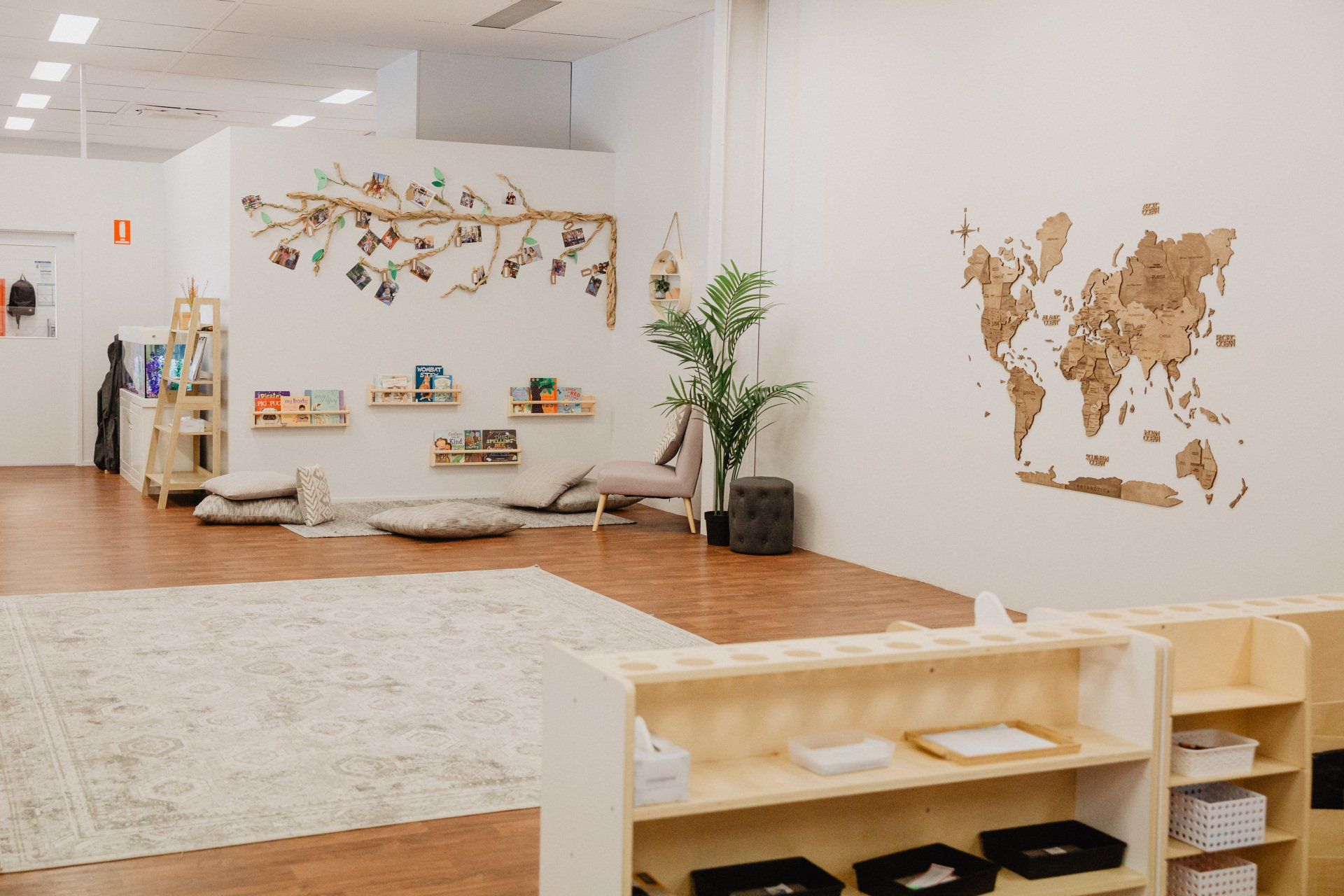 A spacious room at Sagewood Joondalup Campus featuring a large white wall and a warm wooden floor.