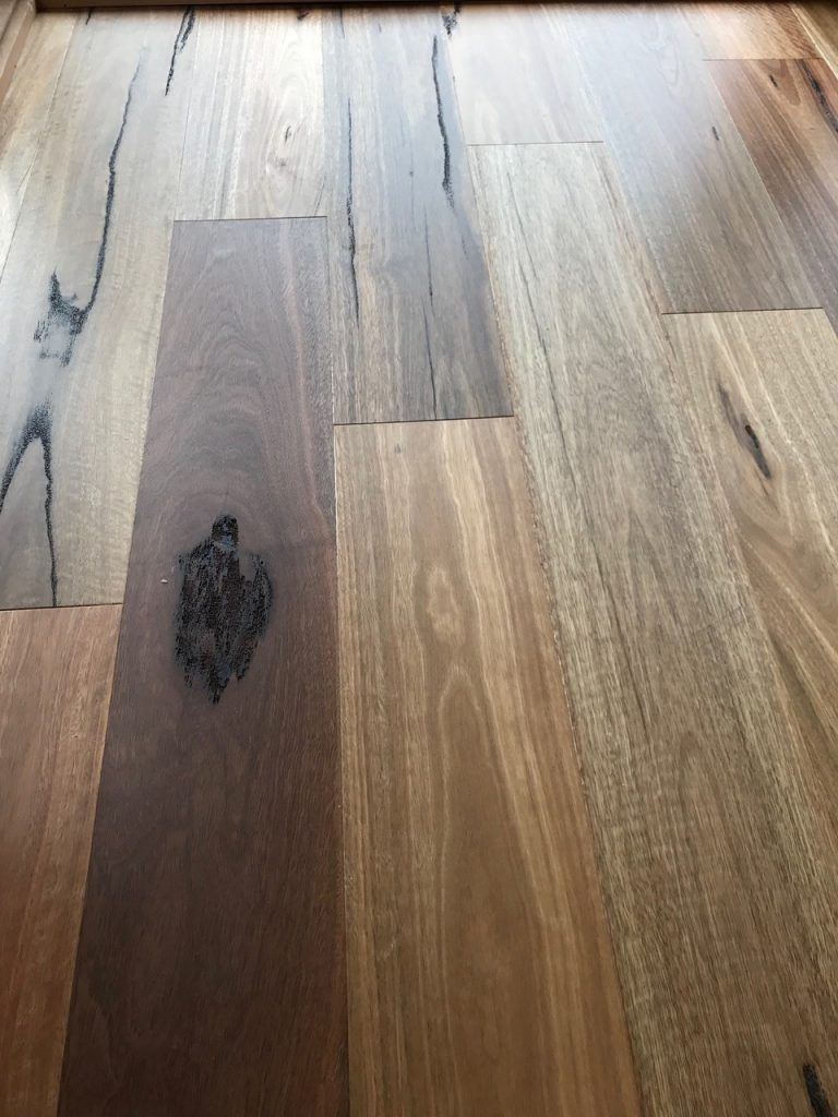 Beautiful Blackbutt Flooring Having Black Spot on Left — Cairns Floors and More In Bungalow, QLD