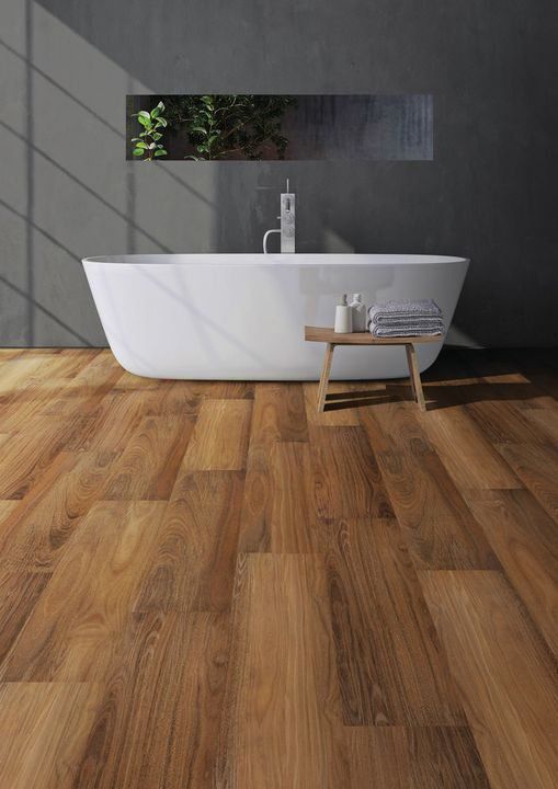 Vinyl Flooring In The Bathroom With Bathtub, Shampoo And Towel — Cairns Floors and More In Bungalow, QLD