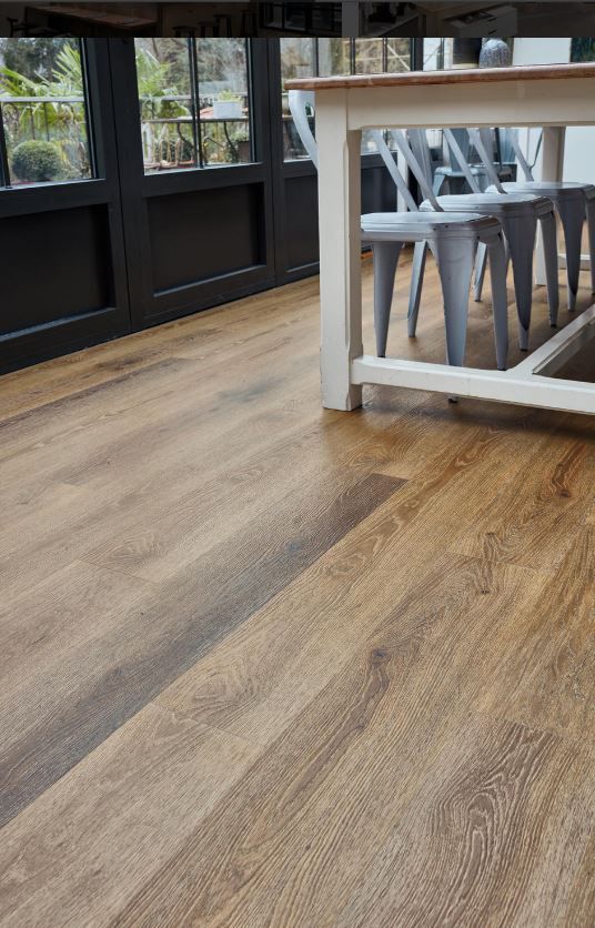 Vinyl Flooring In The Dining Area With Table And Chairs — Cairns Floors and More In Bungalow, QLD