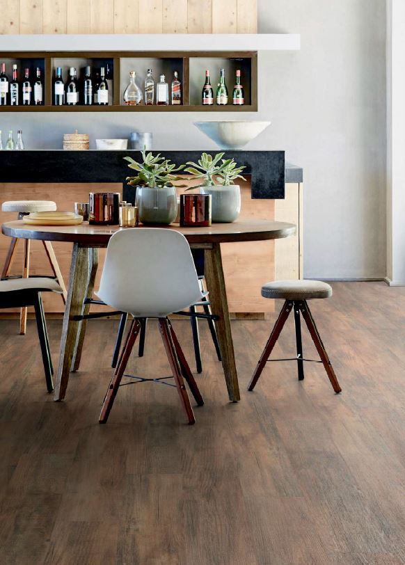 A Dining Room With A Table And Chairs And A Bar — Cairns Floors and More In Port Douglas, QLD