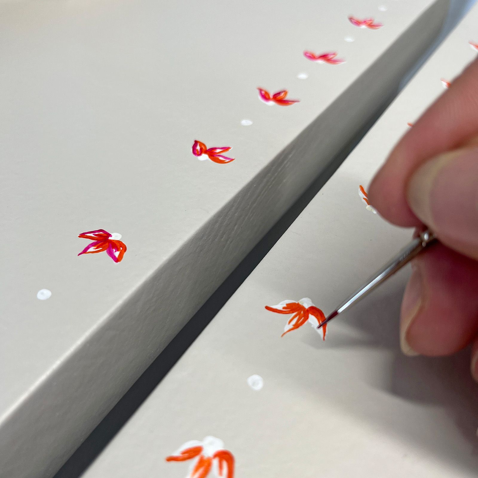 Handpainted flowers on clay bedside cabinet