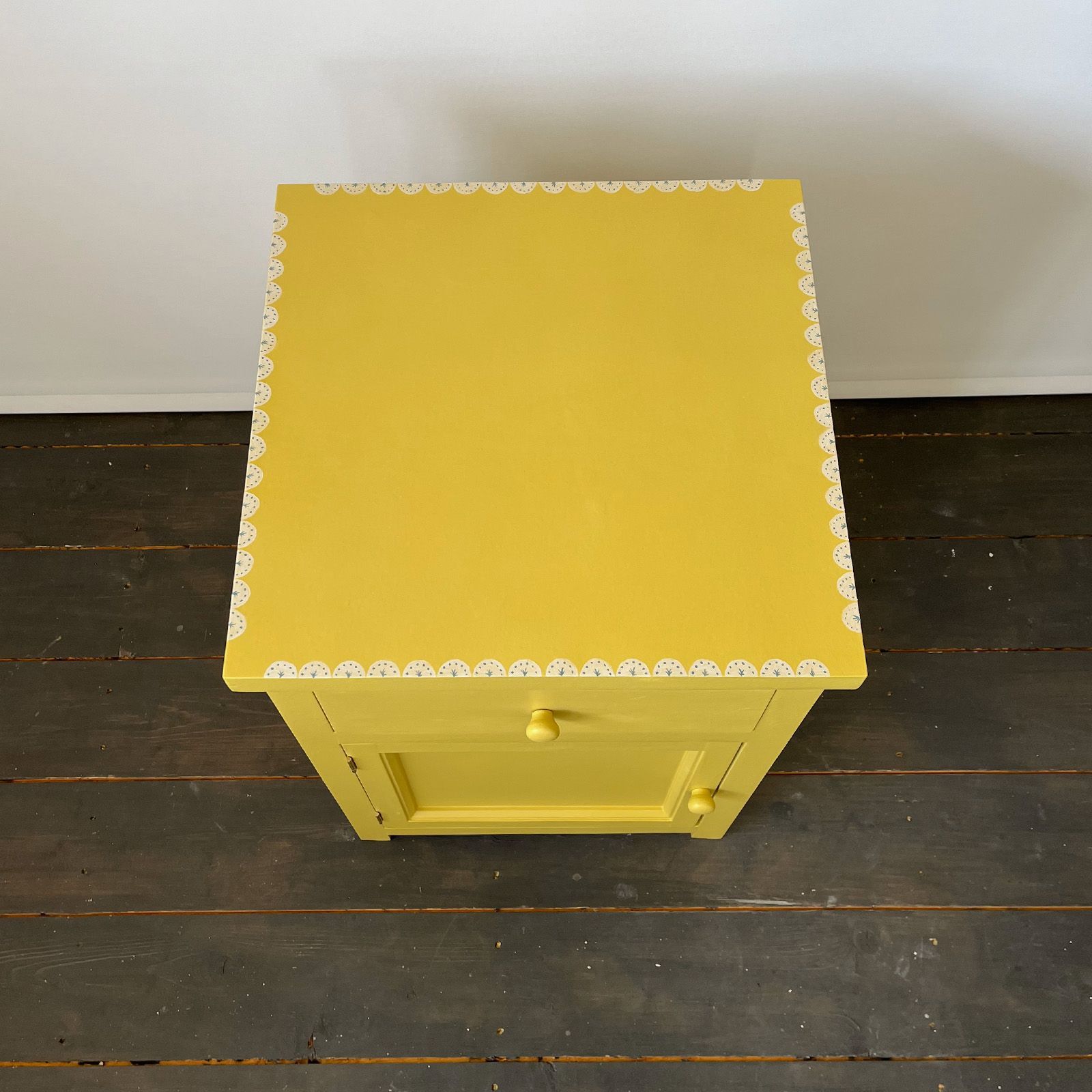 Bedside cabinet with decorative painted border