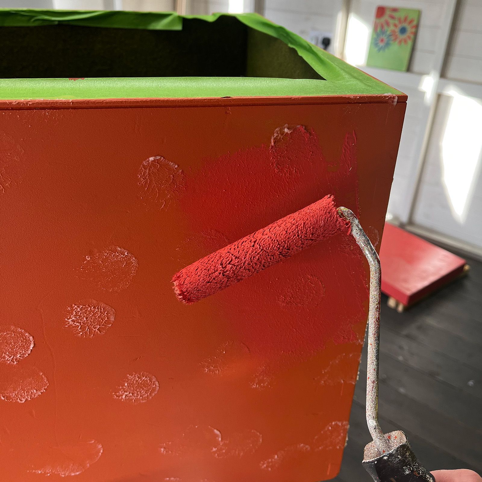 Rolling rose paint over wax to get a bit of base colour through on the carnival chest.