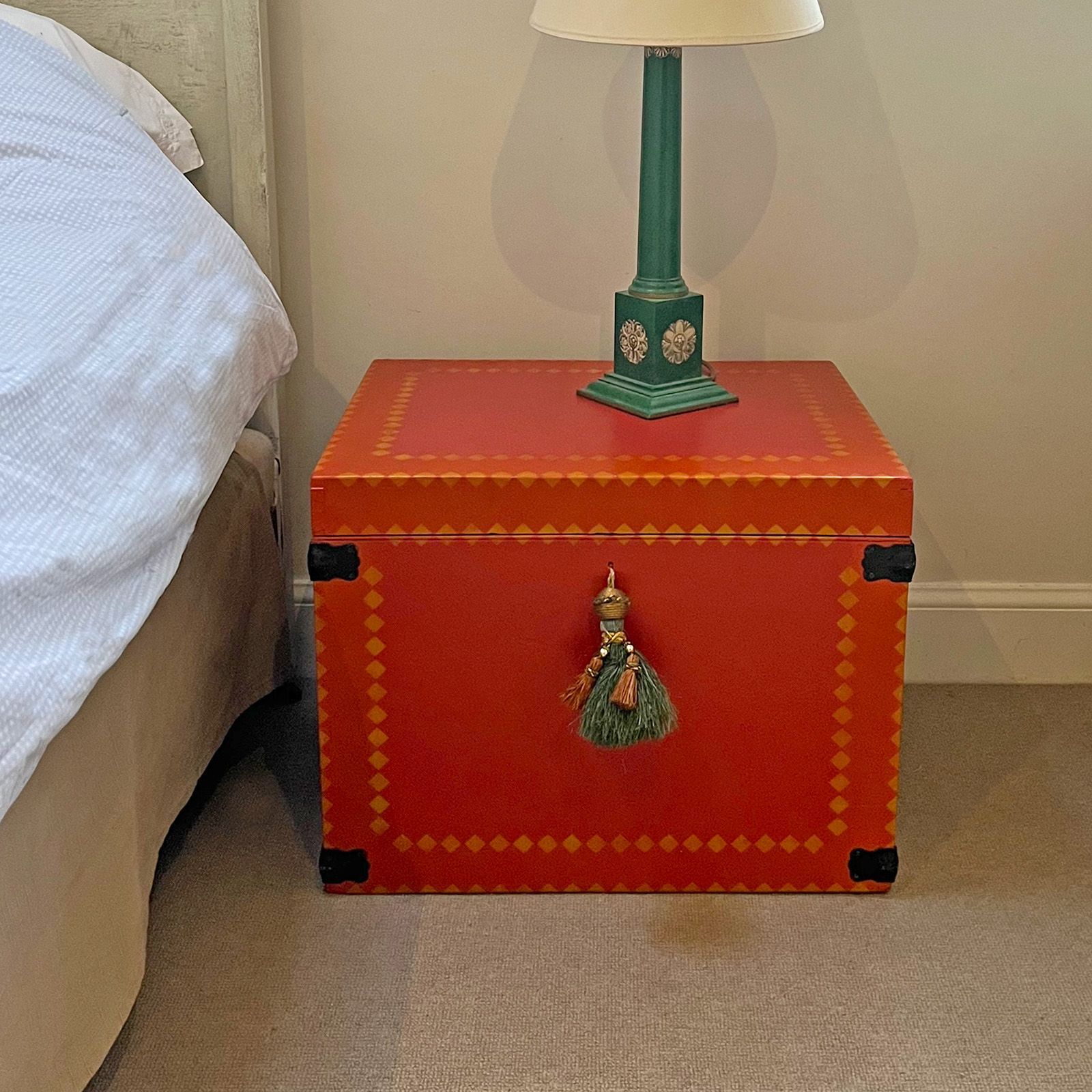 Our upcycled Carnival Chest pictured on site in the clients bedroom.