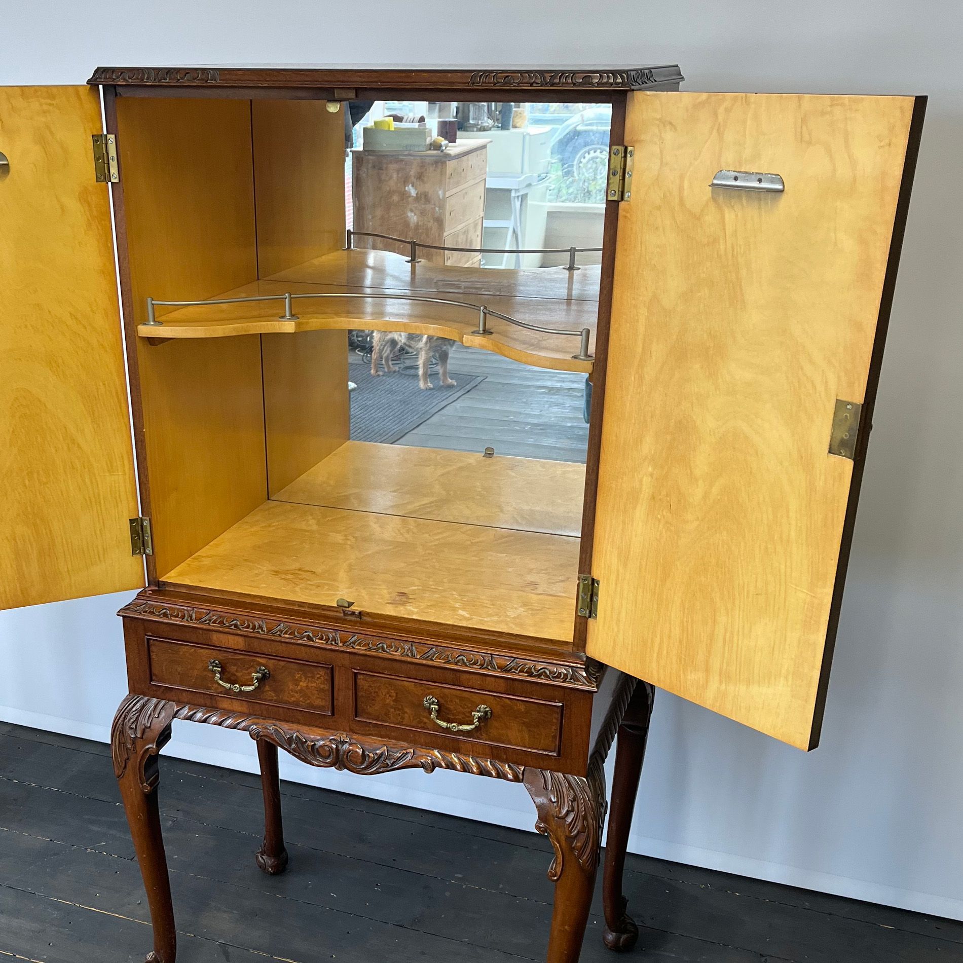 Interior of blue cocktail cabinet before it was upcycled.