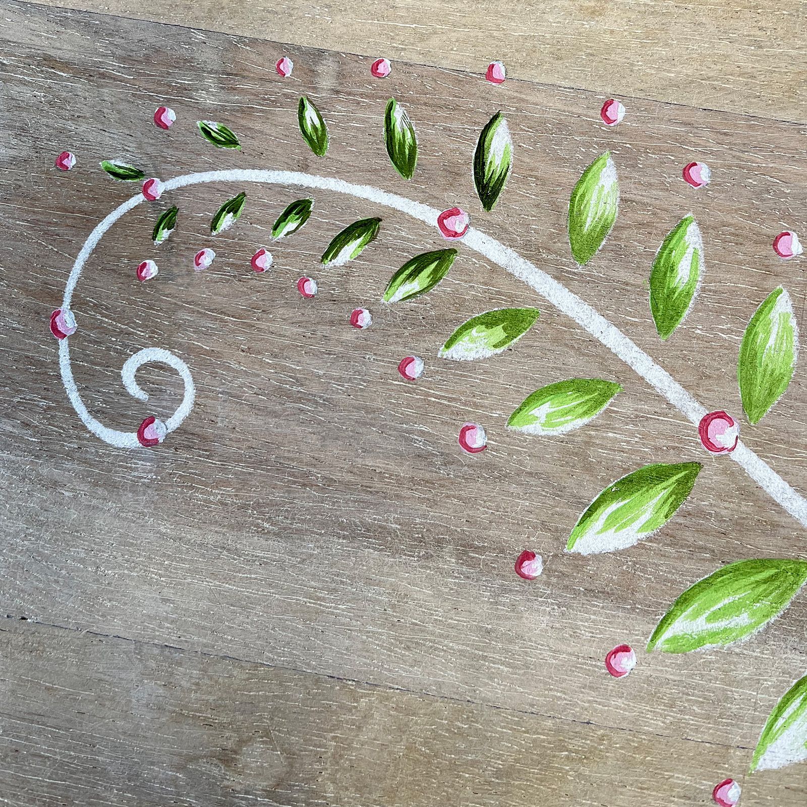Details of fern design on console table.