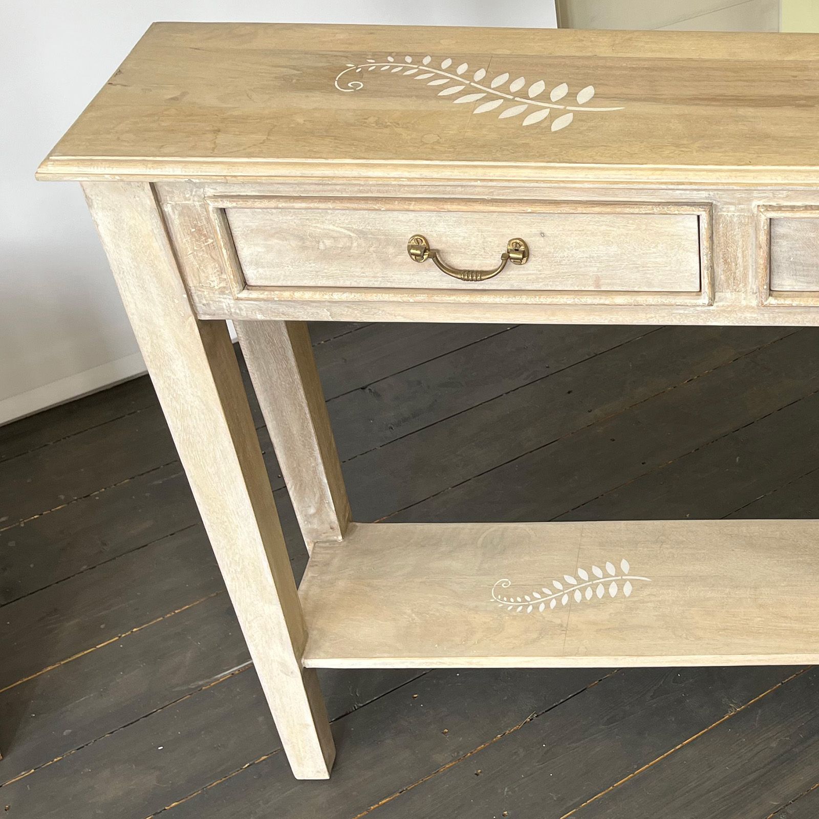 Stenciled white base on fern console table