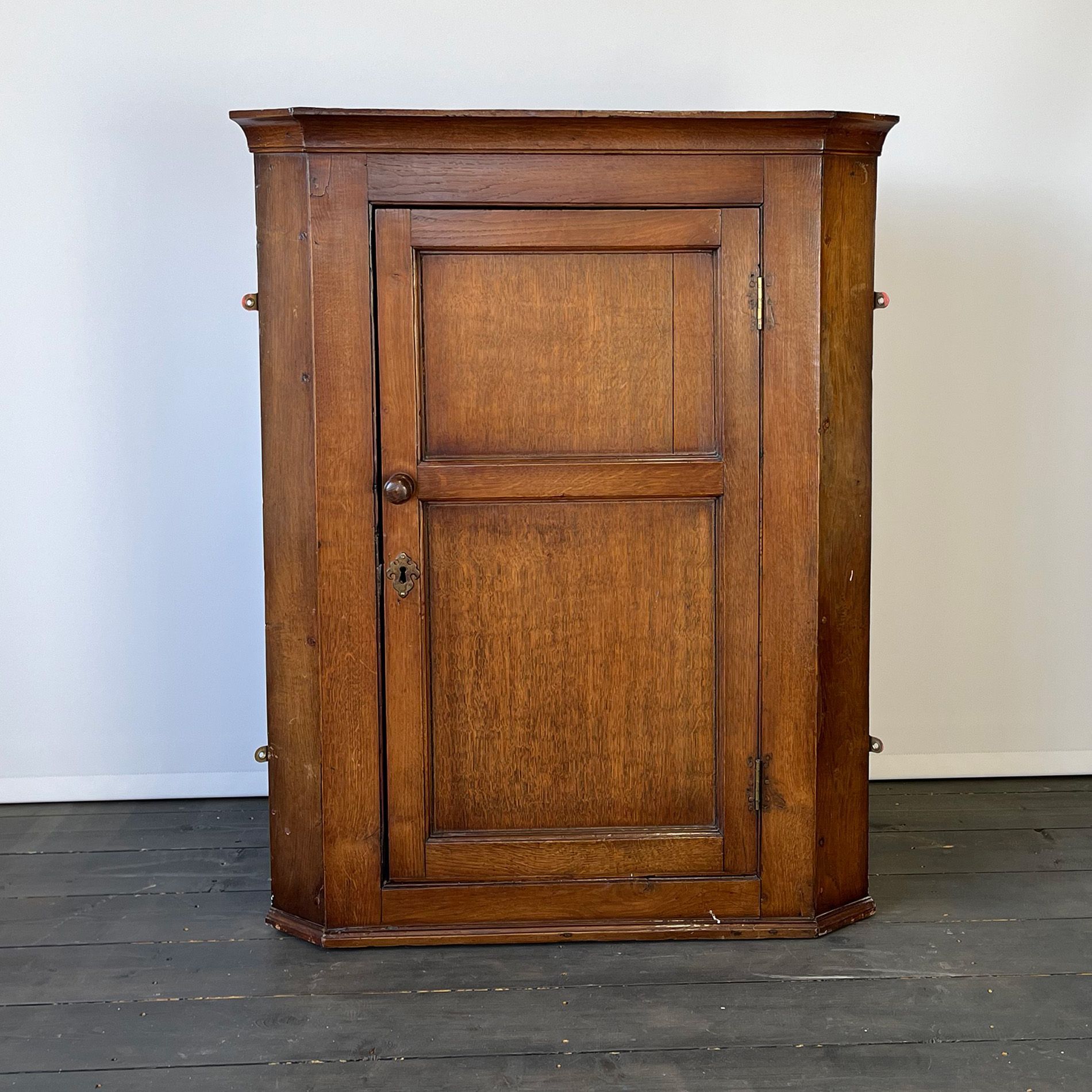 Wall cabinet before being upcycled into shiny red.