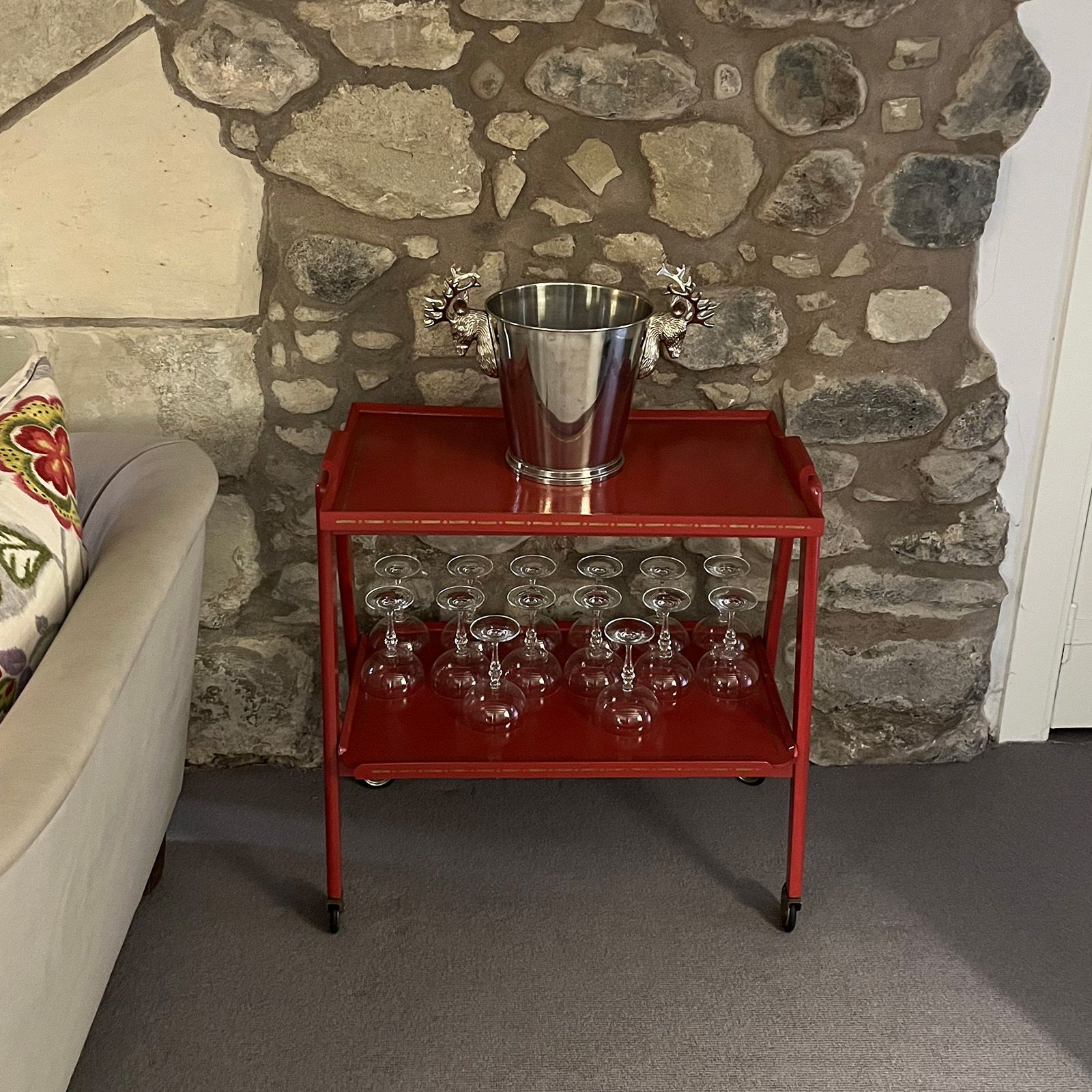 Retro red drinks trolley, ready to offer sustanance to guests.