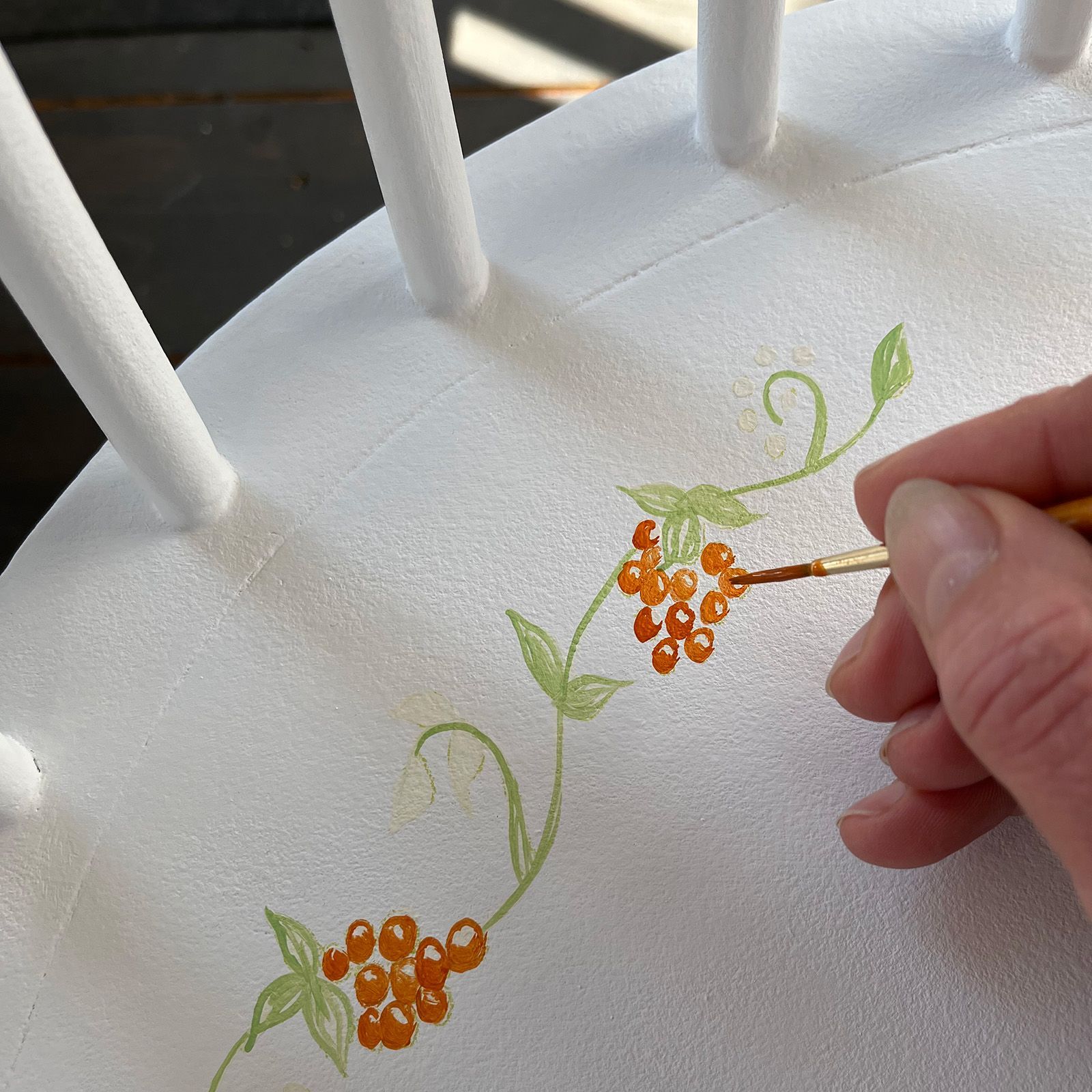 Helen Bateman painting freehand berries