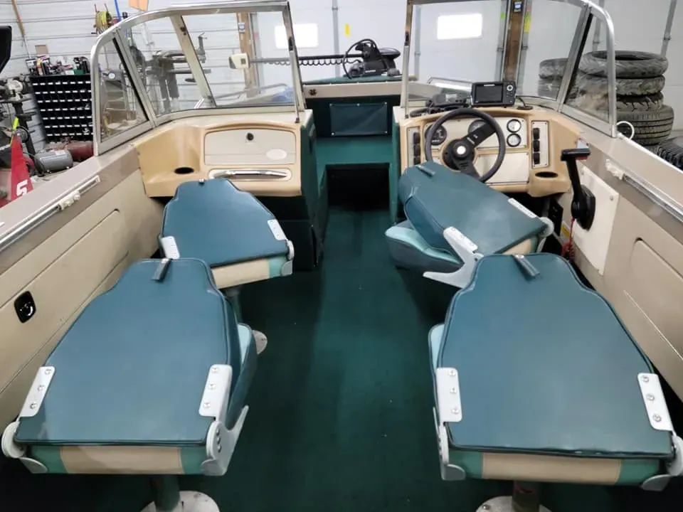 Interior View of a Boat With Four Blue Seats | Steve's Auto Care, Inc.