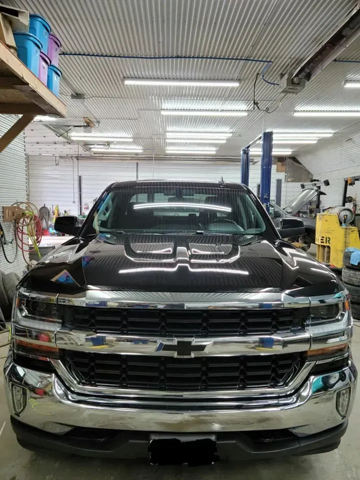 Black Chevrolet Pickup Truck in Garage | Steve's Auto Care, Inc.